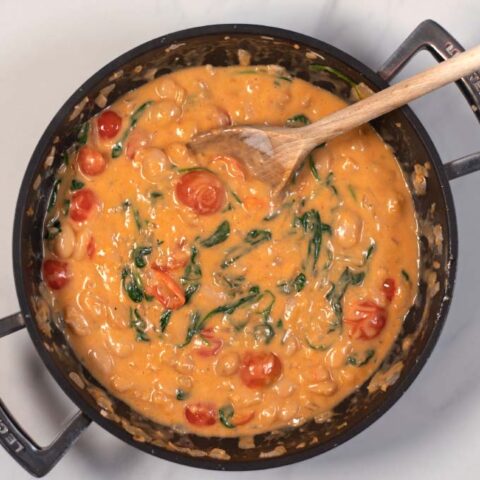 Spinach is wilted into the Marry Me Butter Beans.