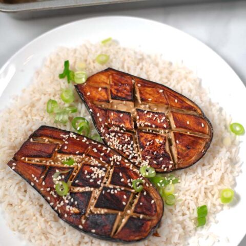 Miso Eggplant garnished with fresh scallions and sesame seeds.