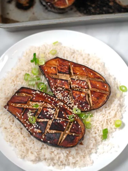 Miso Eggplant garnished with fresh scallions and sesame seeds.
