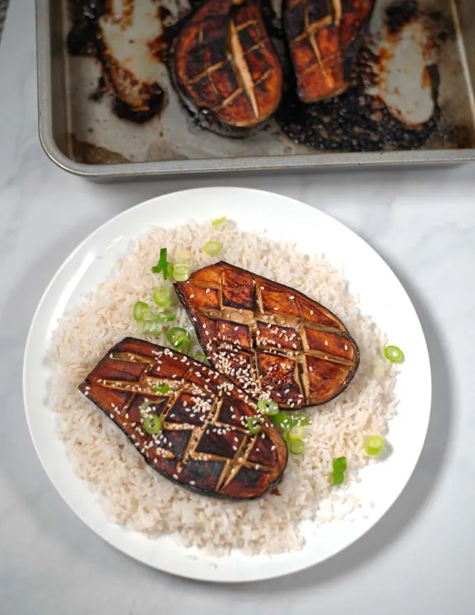 Closeup on a serving of Miso Eggplant with rice.