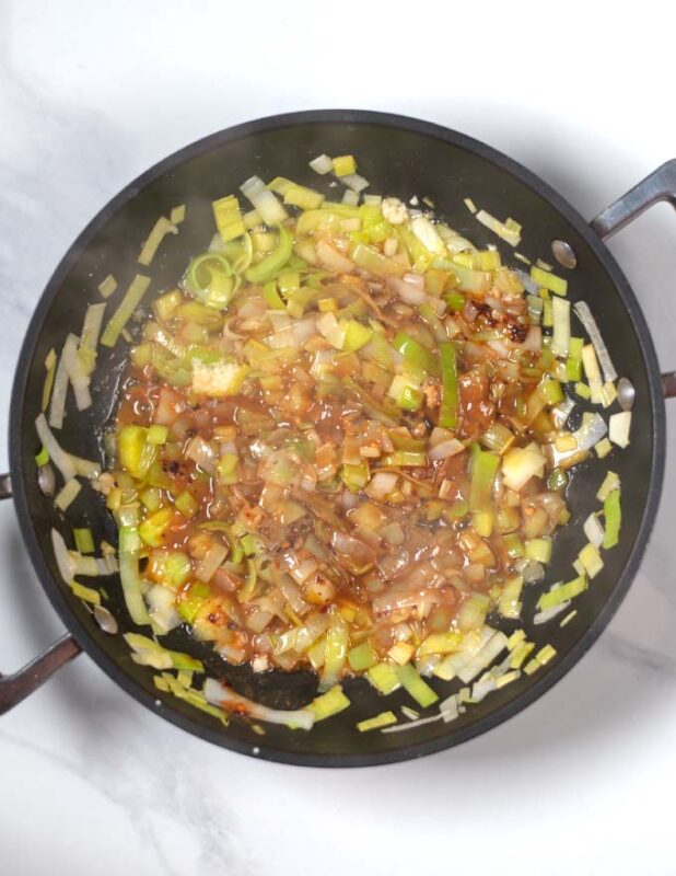 Miso and spices are mixed with the buttered leek.