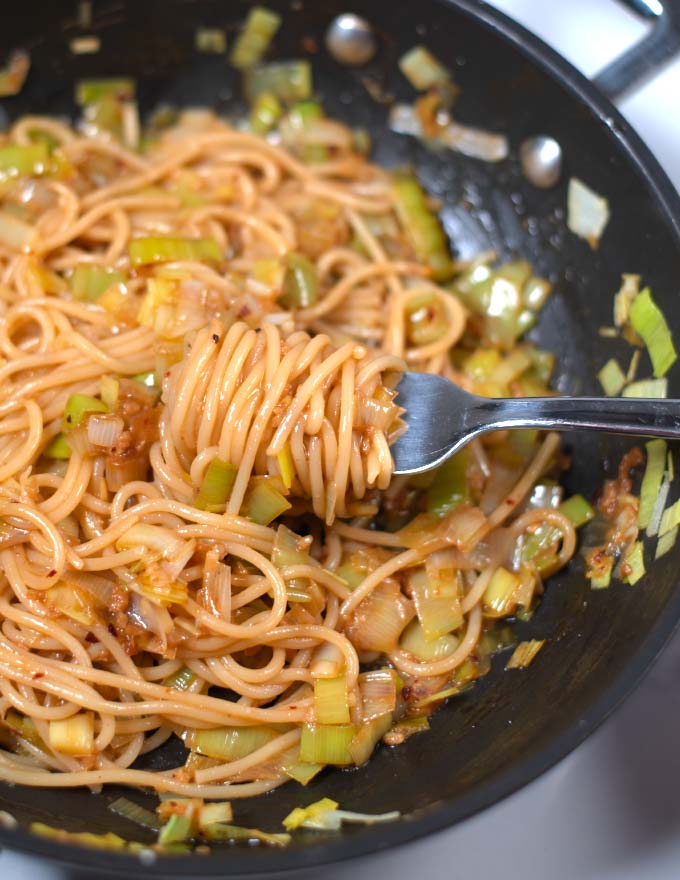 A fork in the pan with the ready dish.