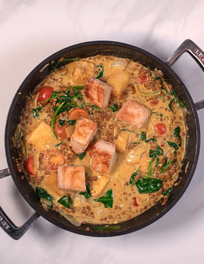 Fried and cripsy tofu cubes are added to the curry.