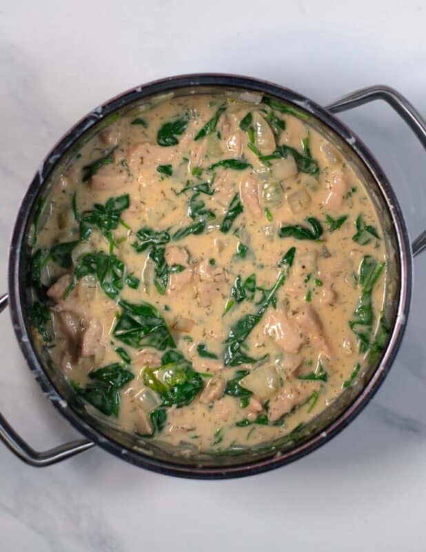 Fresh spinach is added to the Crack Chicken Soup.