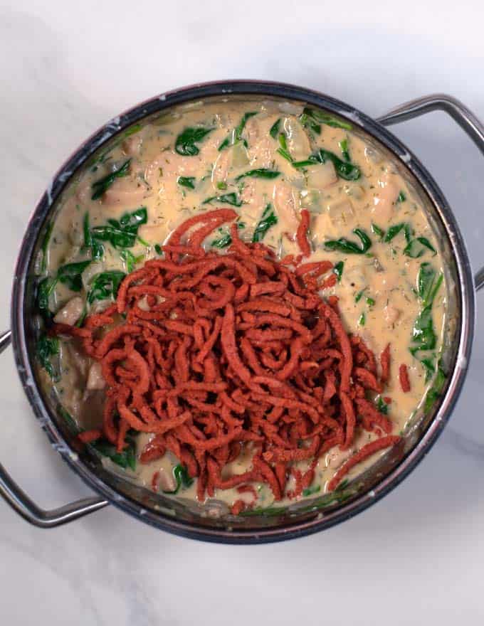 The pre-fried bacon is mixed with the soup.