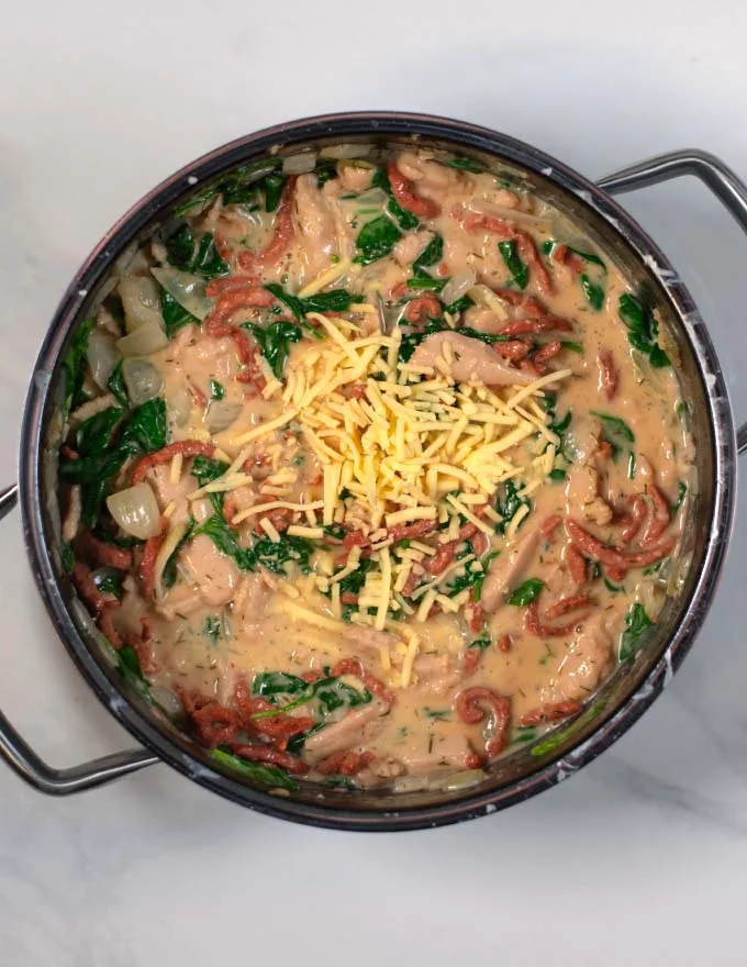 Grated cheese is used as topping for Crack Chicken Soup