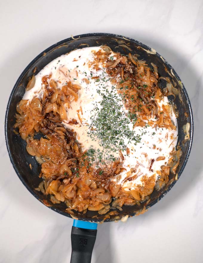 Coconut milk and thyme are added to the sauce.