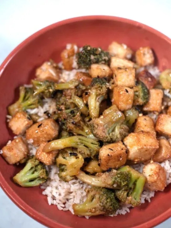 Closeup of a serving of Tofu and Broccoli over rice.