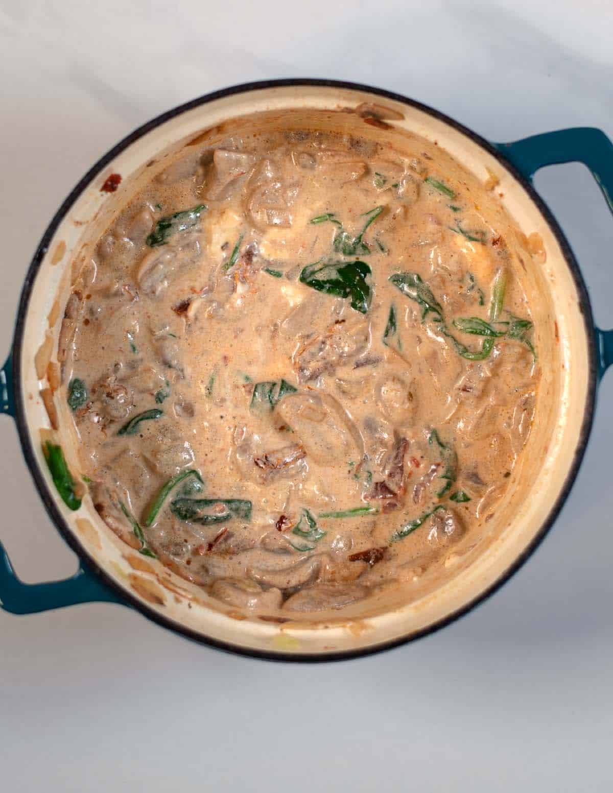 Vegan sour cream is added to the vegetables to make the creamy sauce for the Marry Me Orzo.