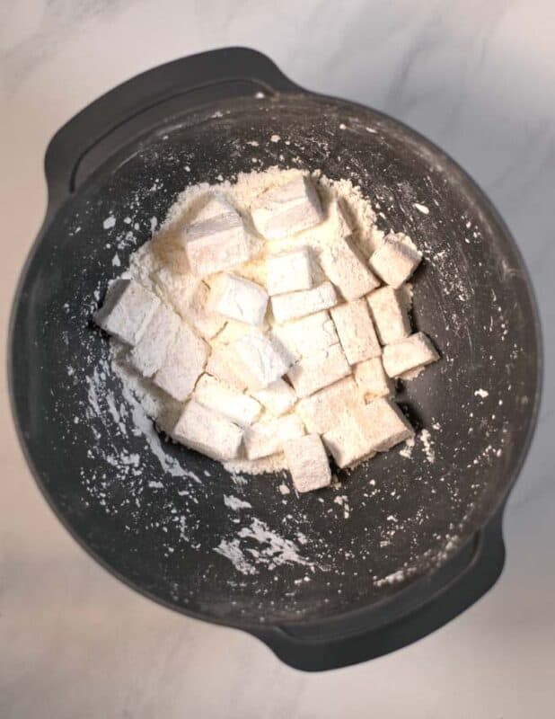 Tofu cubes are coated in cornstarch.