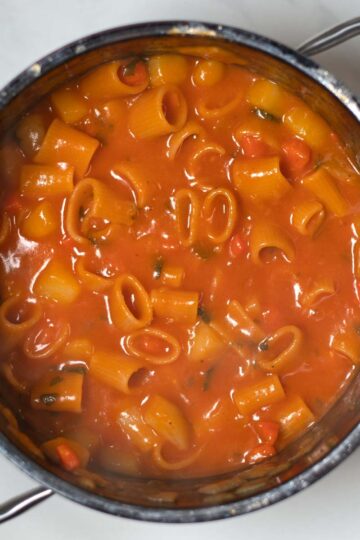 Pasta e Patate are cooked in the a pot.