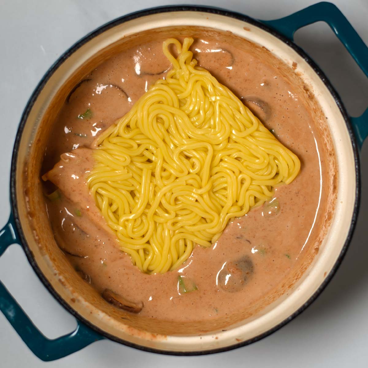 Instant Ramen noodles are given to the sauce.