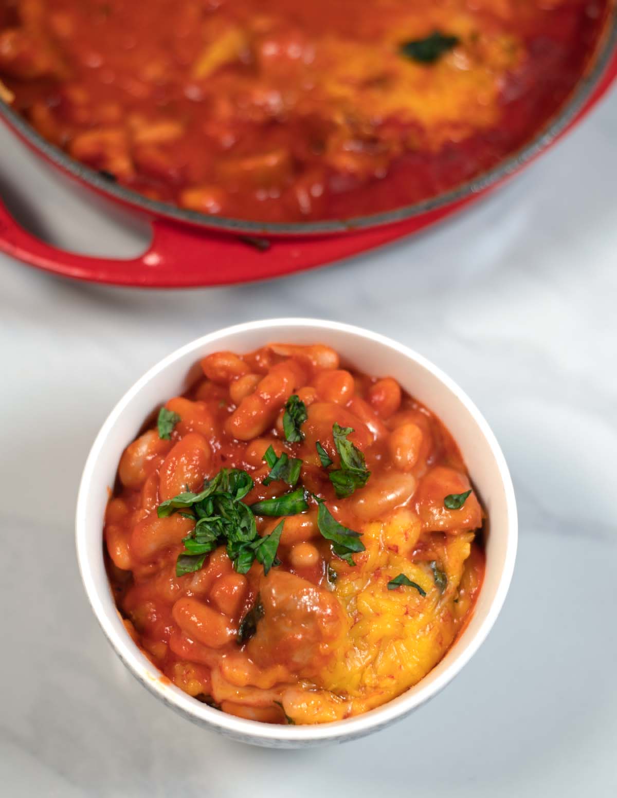 A serving of Pizza Beans in a white bowl.