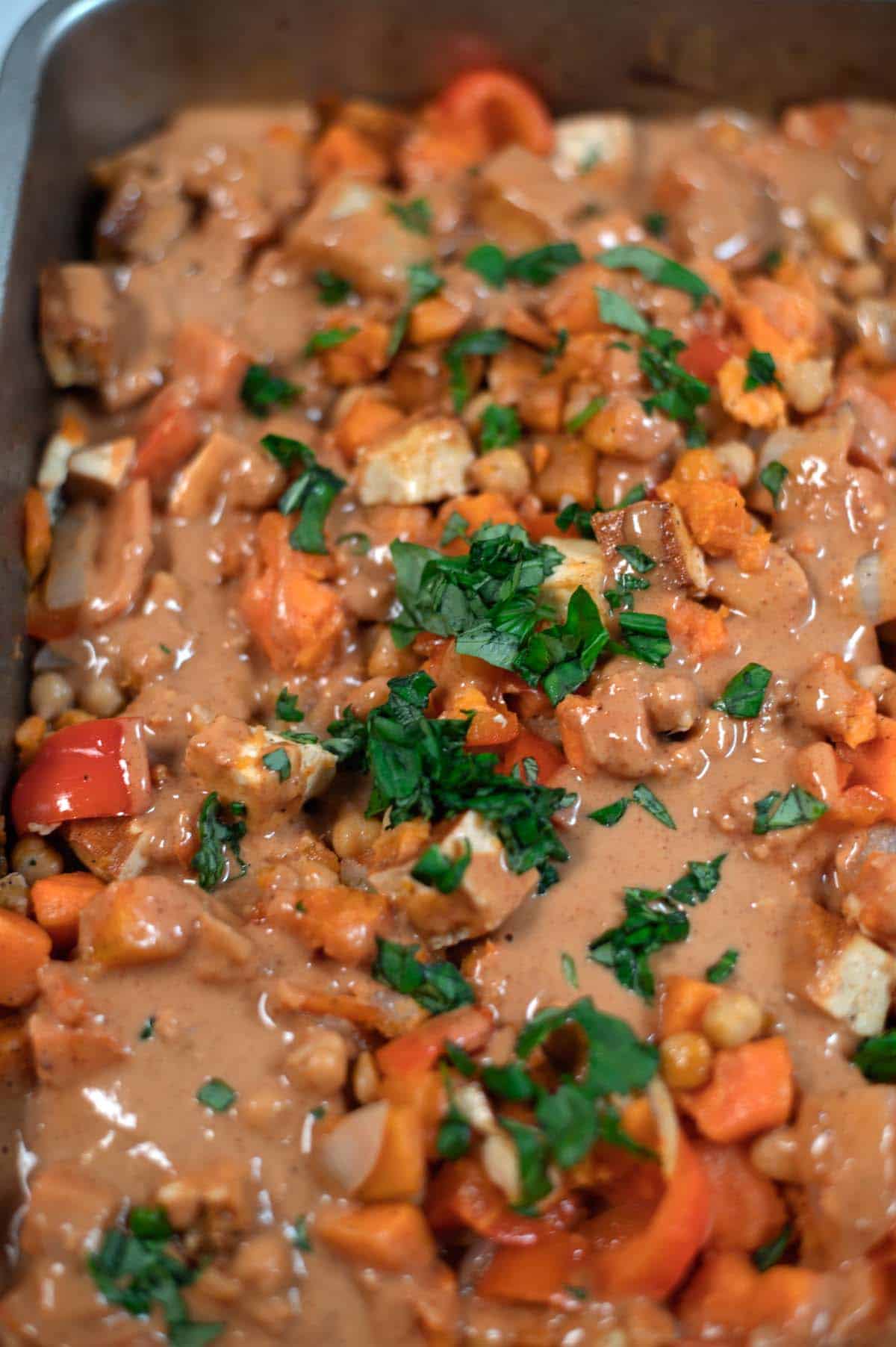 Fresh basil is used as garnish for the Sweet Potato Salad.