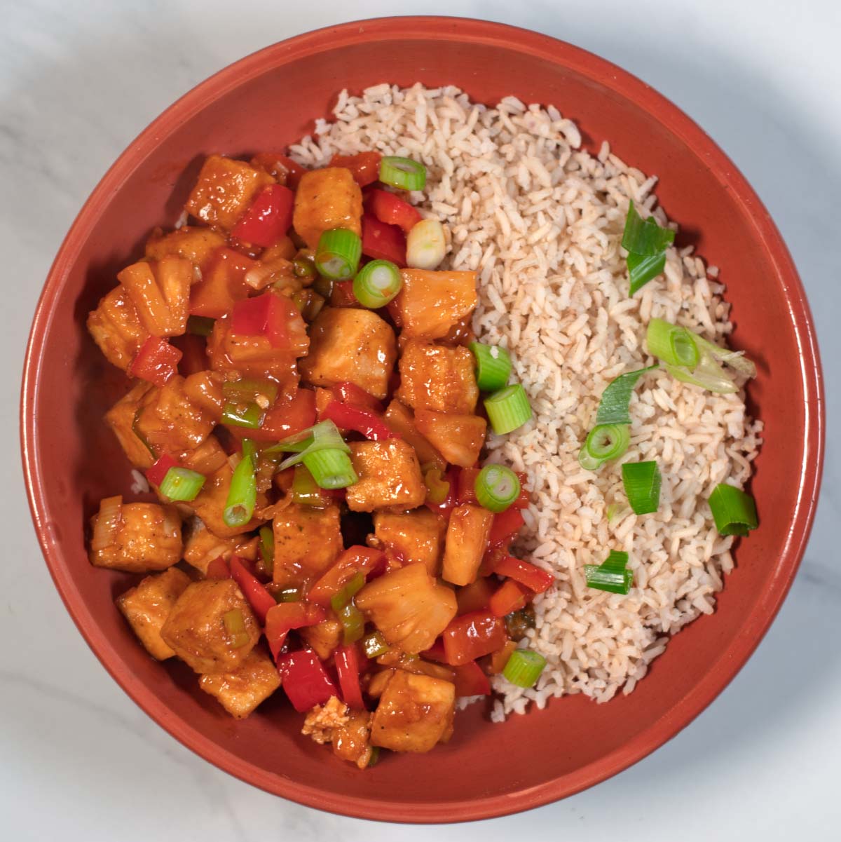 A serving of Sweet and Sour Tofu with white rice.