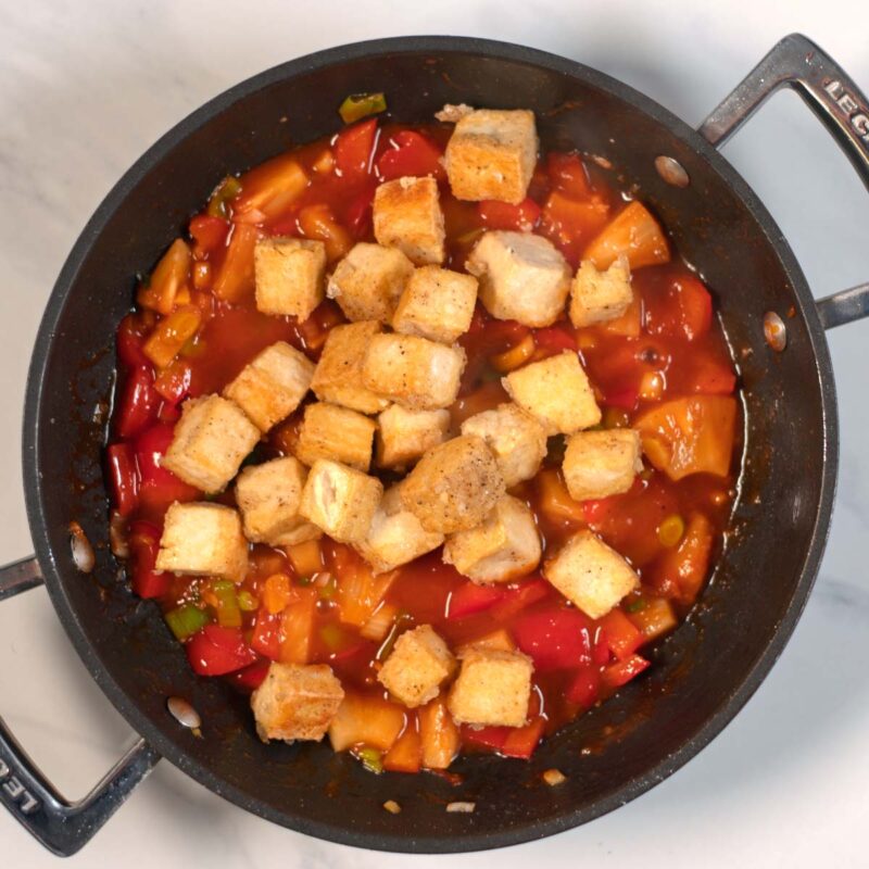 Fried tofu cubes are added back to the pan with the Sweet and Sour sauce.