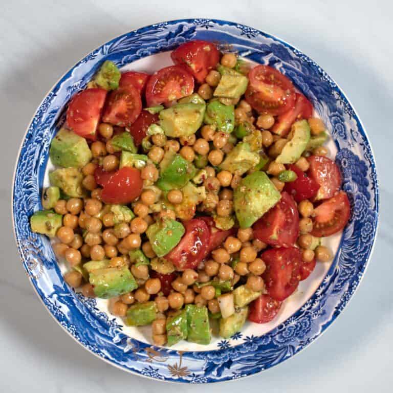 Avocado and Chickpea Salad served in a blue low bowl.