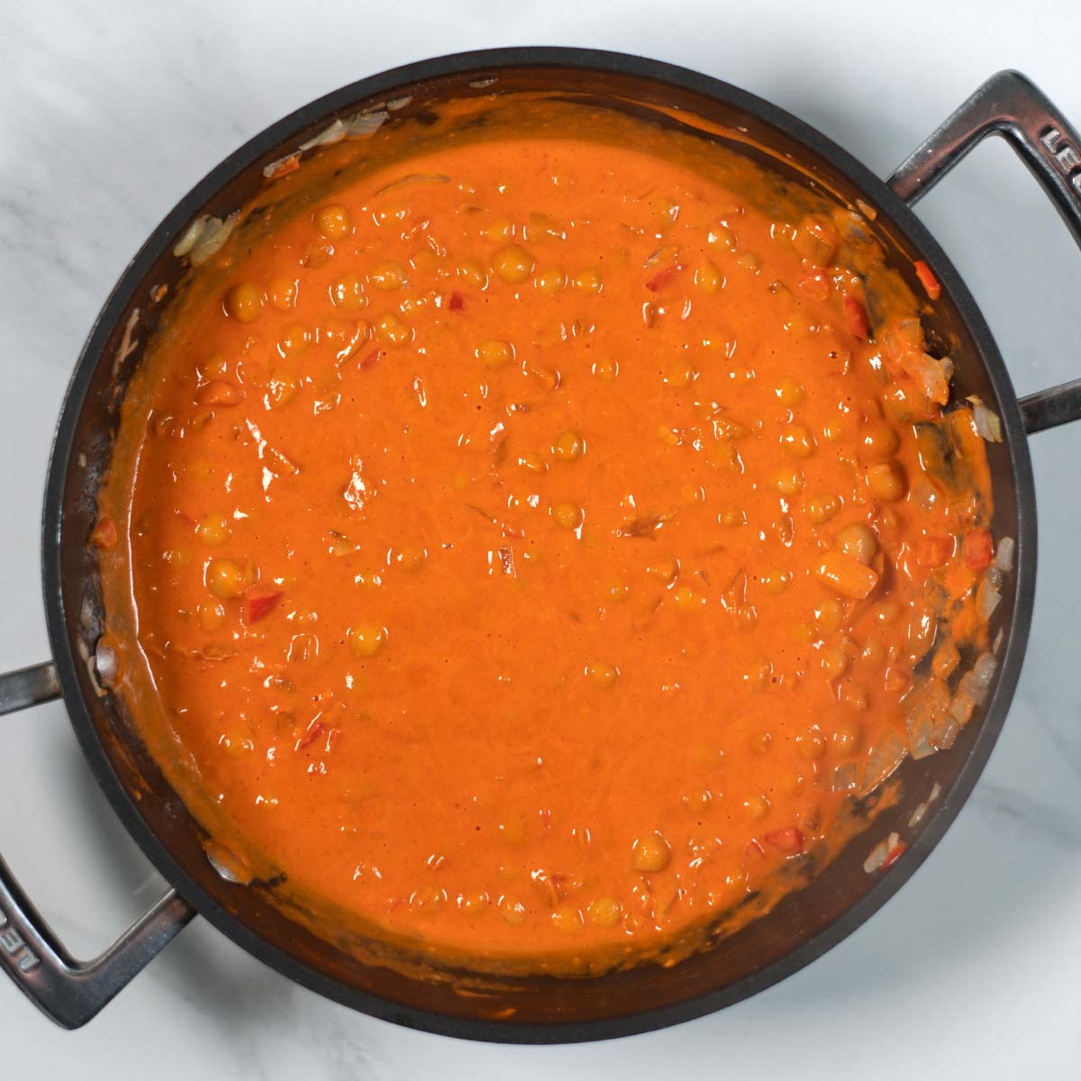 View of the cramt tomato sauce of Butter Chickpeas.