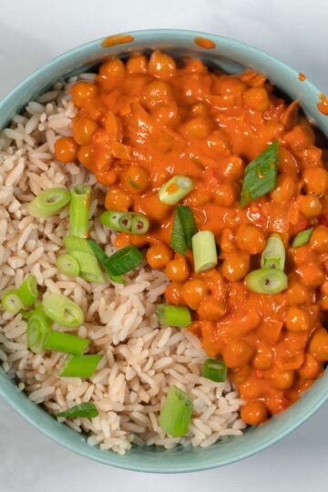 Serving of Butter Chickpeas with rice in a bowl.