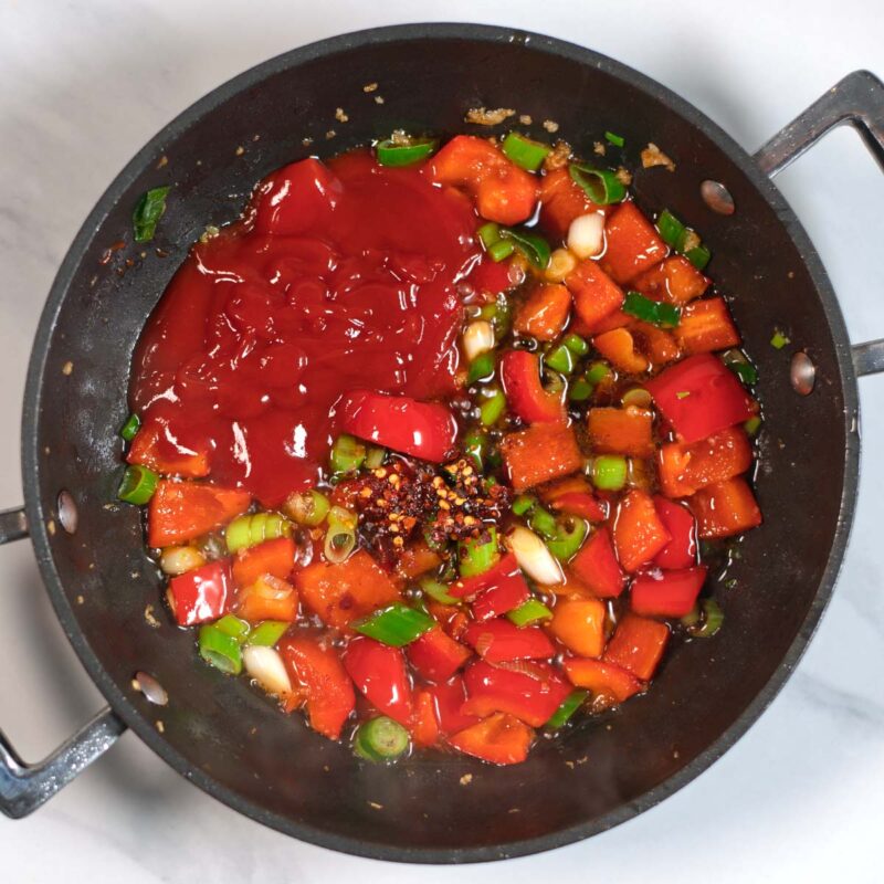 Sauce ingredients are given into the pan with the vegetables.