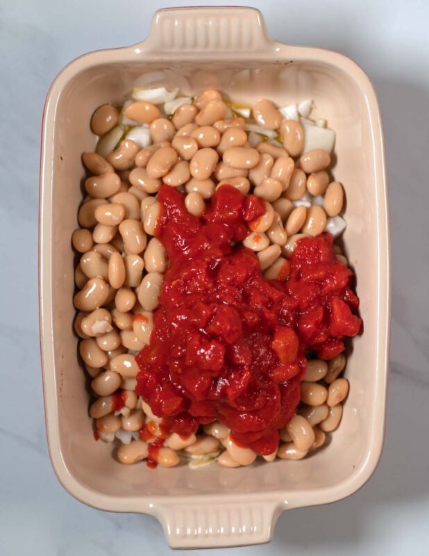 Diced tomatoes are the next ingredients for Gigantes Plaki.