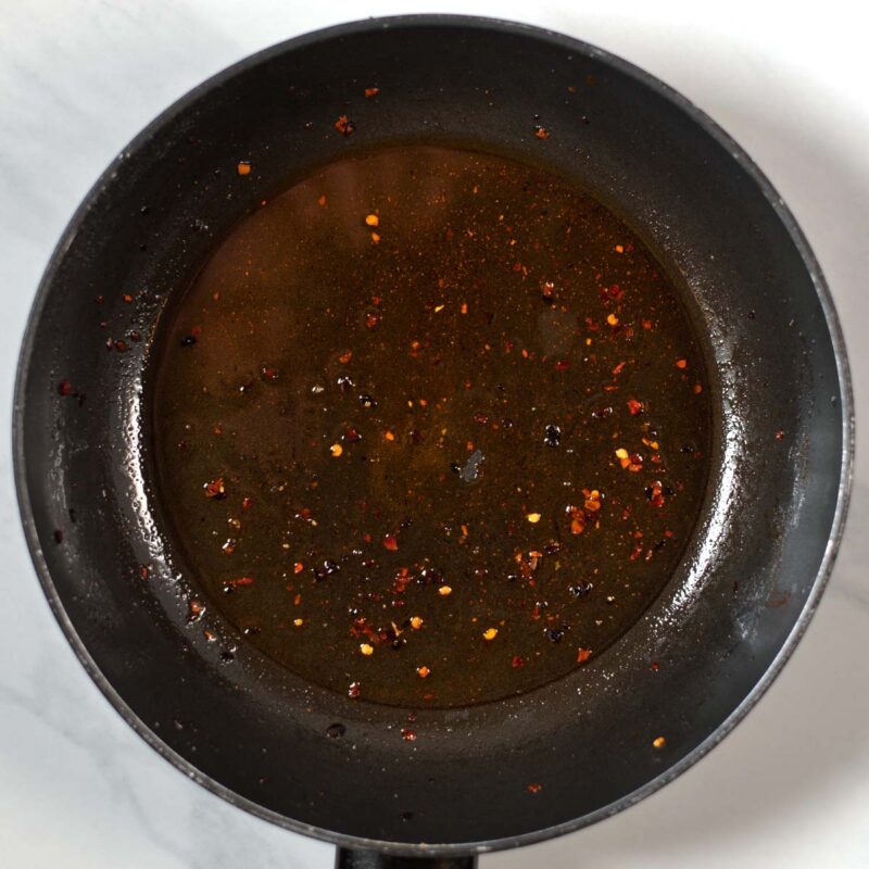 Spicy oil in a pan.