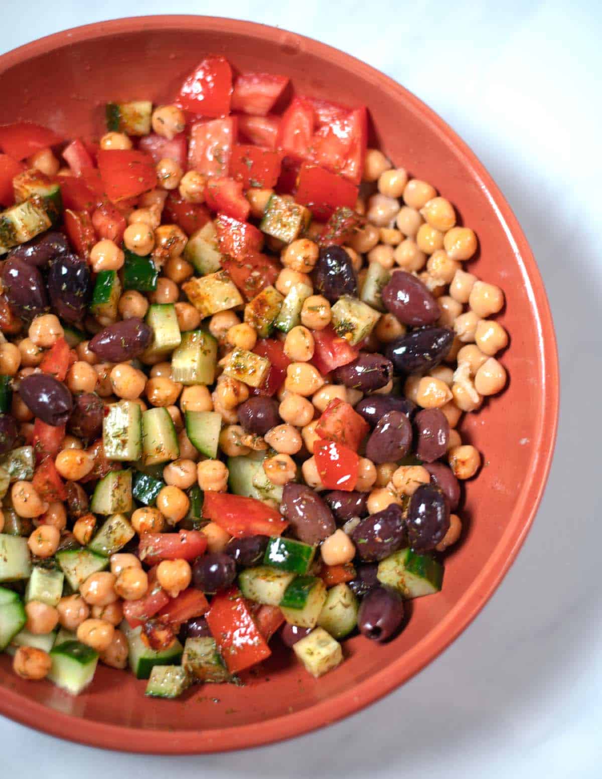 Dressing coats Greek Chickpea Salad.