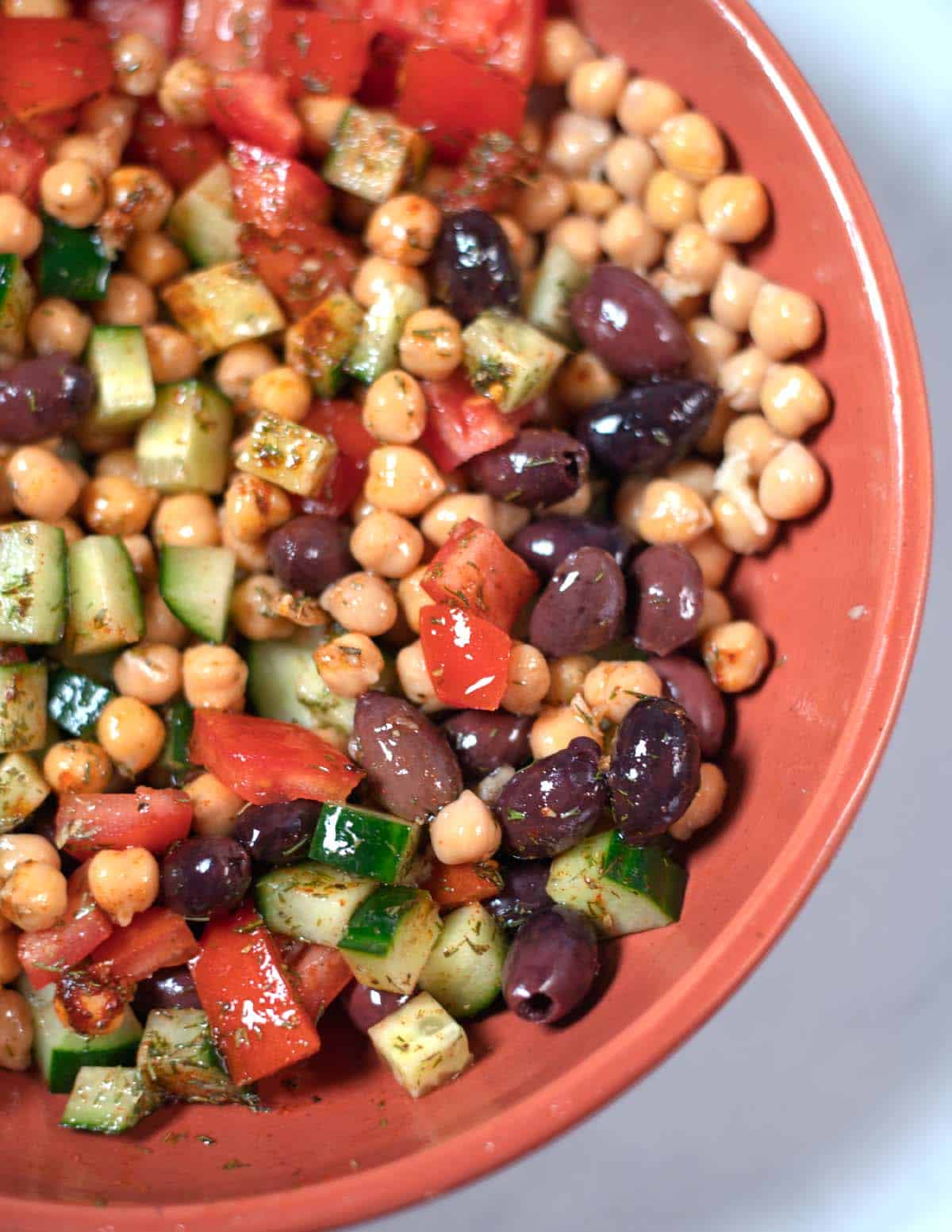 Greek Chickpea Salad is served in a large bowl.