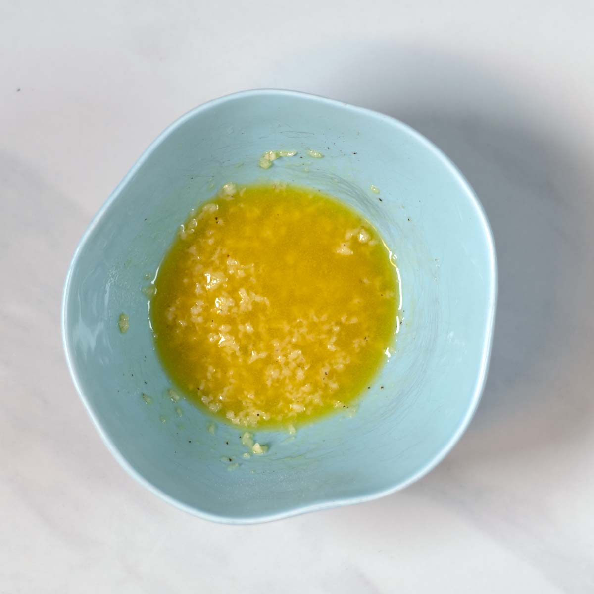 The dressing for the Marry Me Salad is a small bowl.