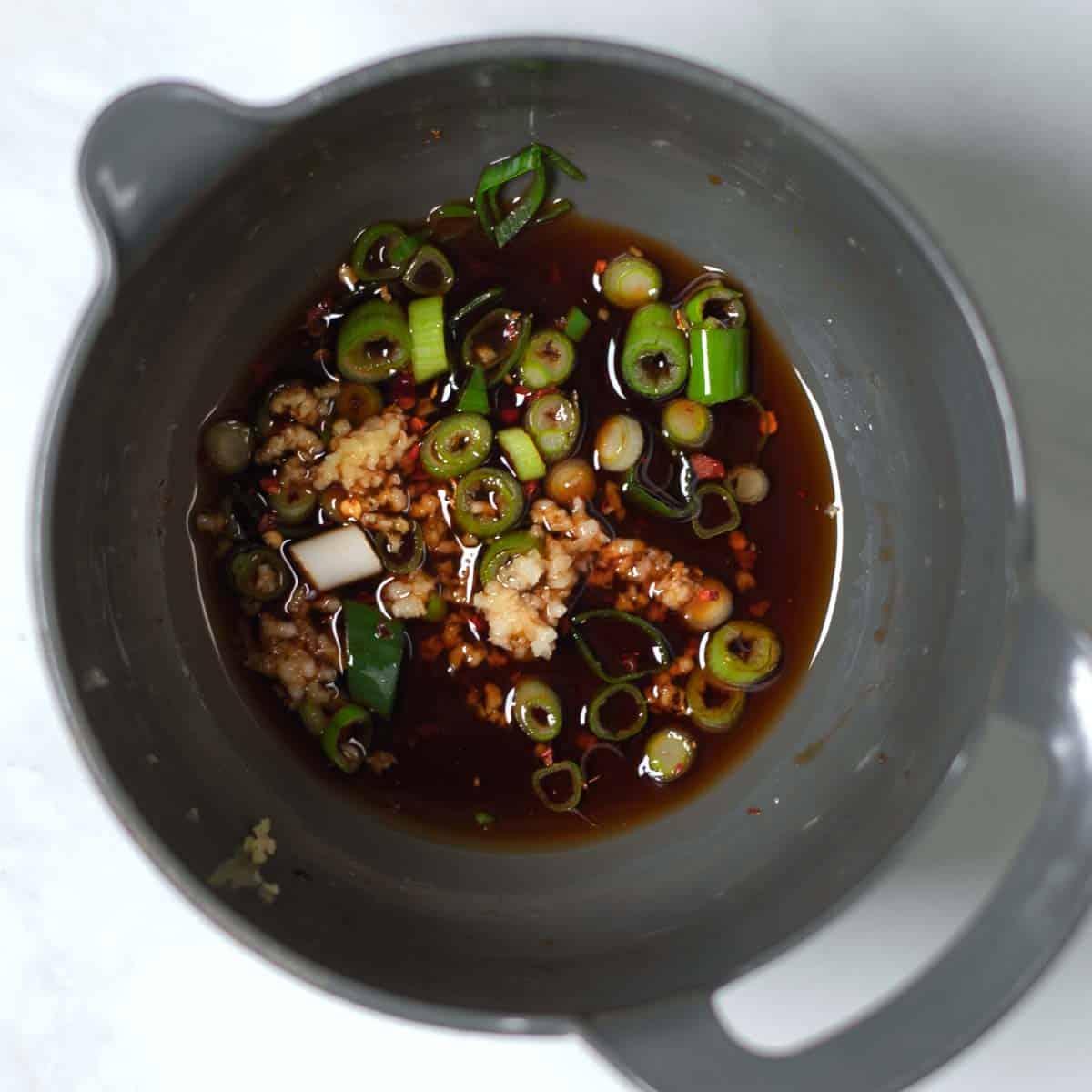View on a mixing bowl with Gyoza Sauce ingredients.