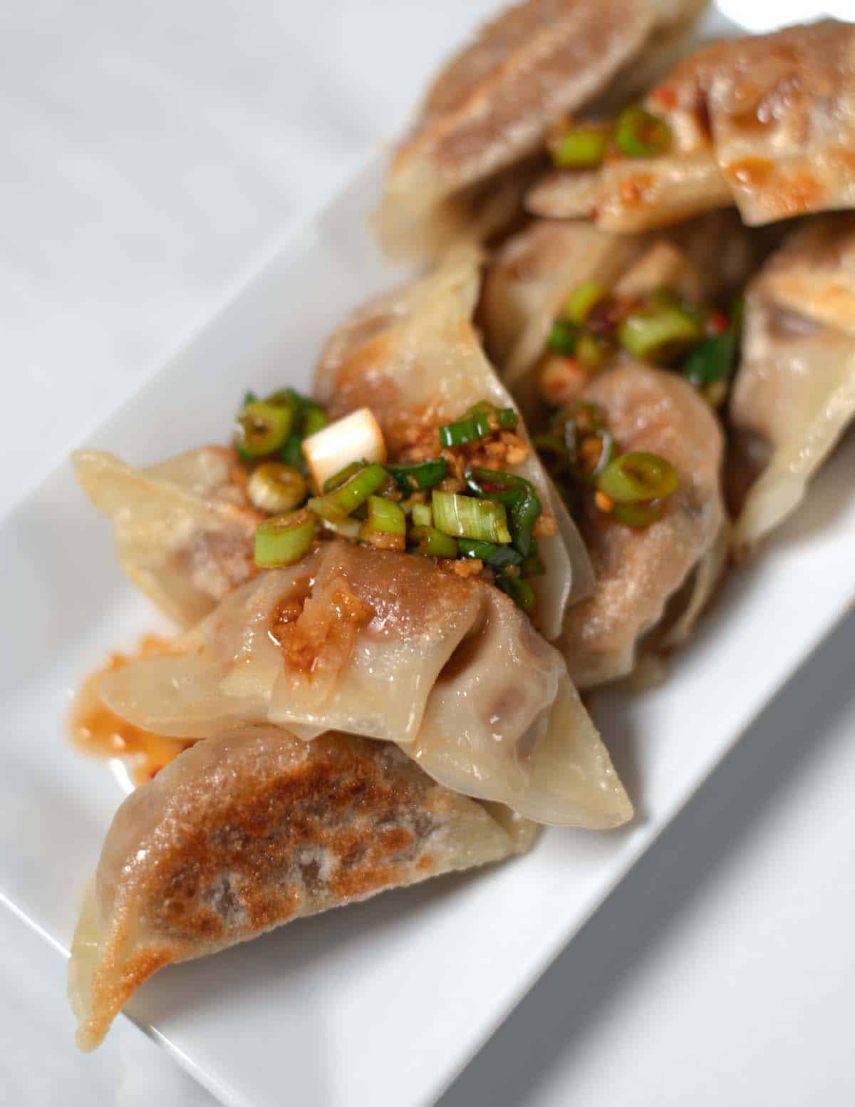 Serving of dumplings with Gyoza Sauce.