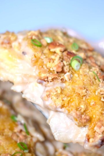Showing the layers and creamy sauce of this baked potato casserole.