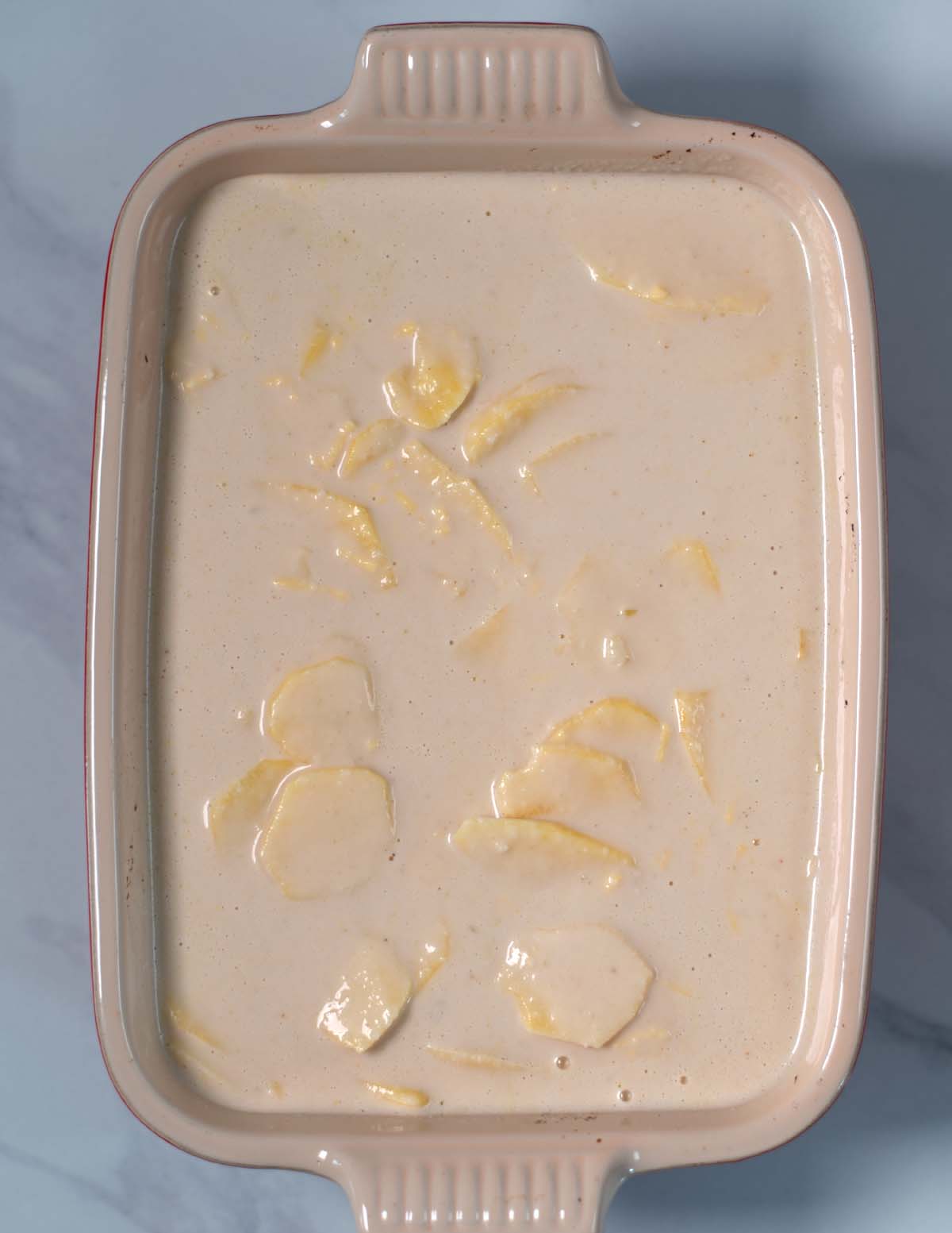 Million Dollar Potatoes are given into a baking dish.