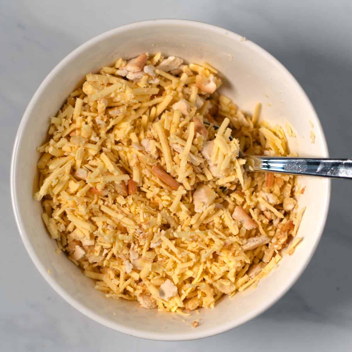 The crunchy topping for the Million Dollar Potatoes are mixed in a small bowl.