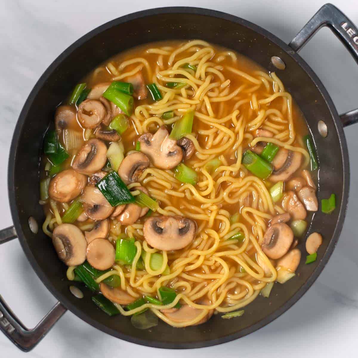 A saucpan with Ramen Noodles.