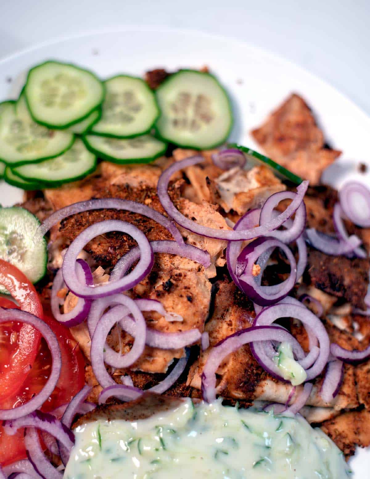Shaved Tofu Gyros served with onions.
