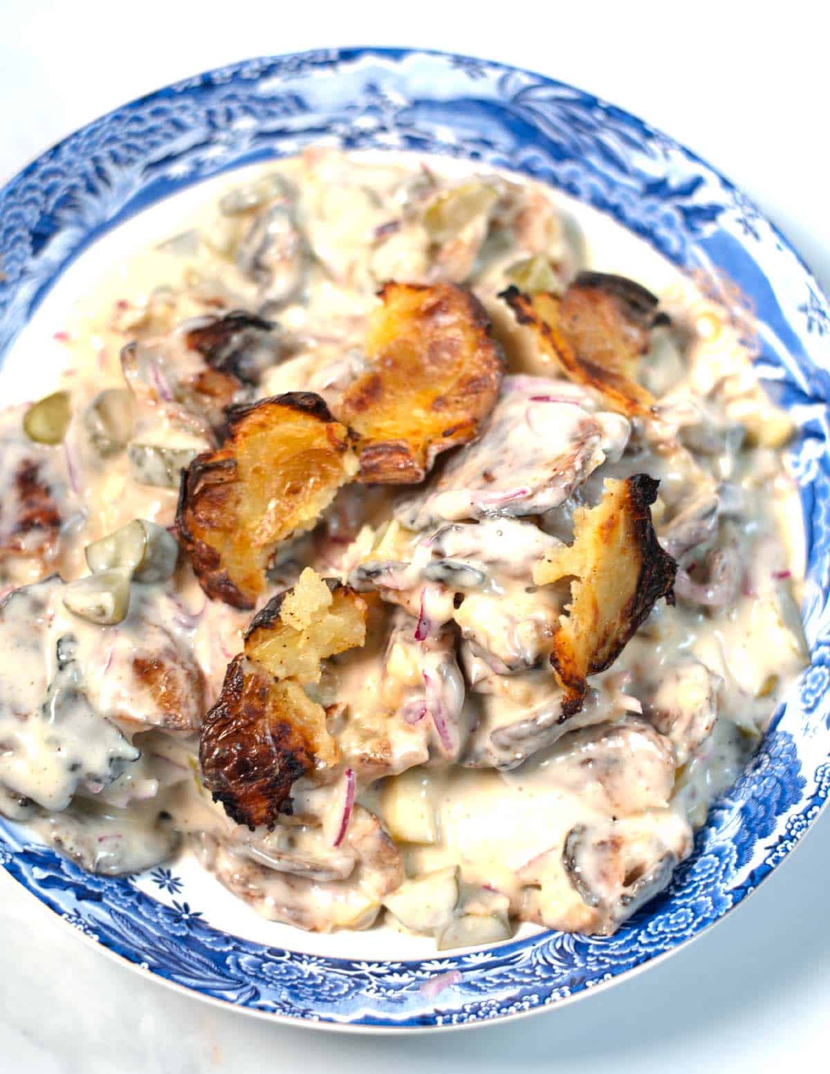 Closeup of smashed poatao salad.