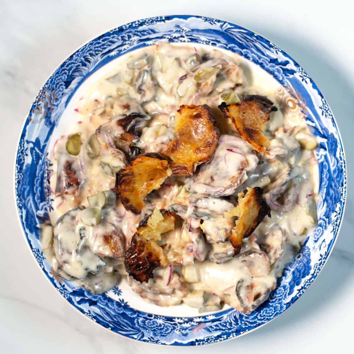 Smashed Potato Salad in a large serving bowl.