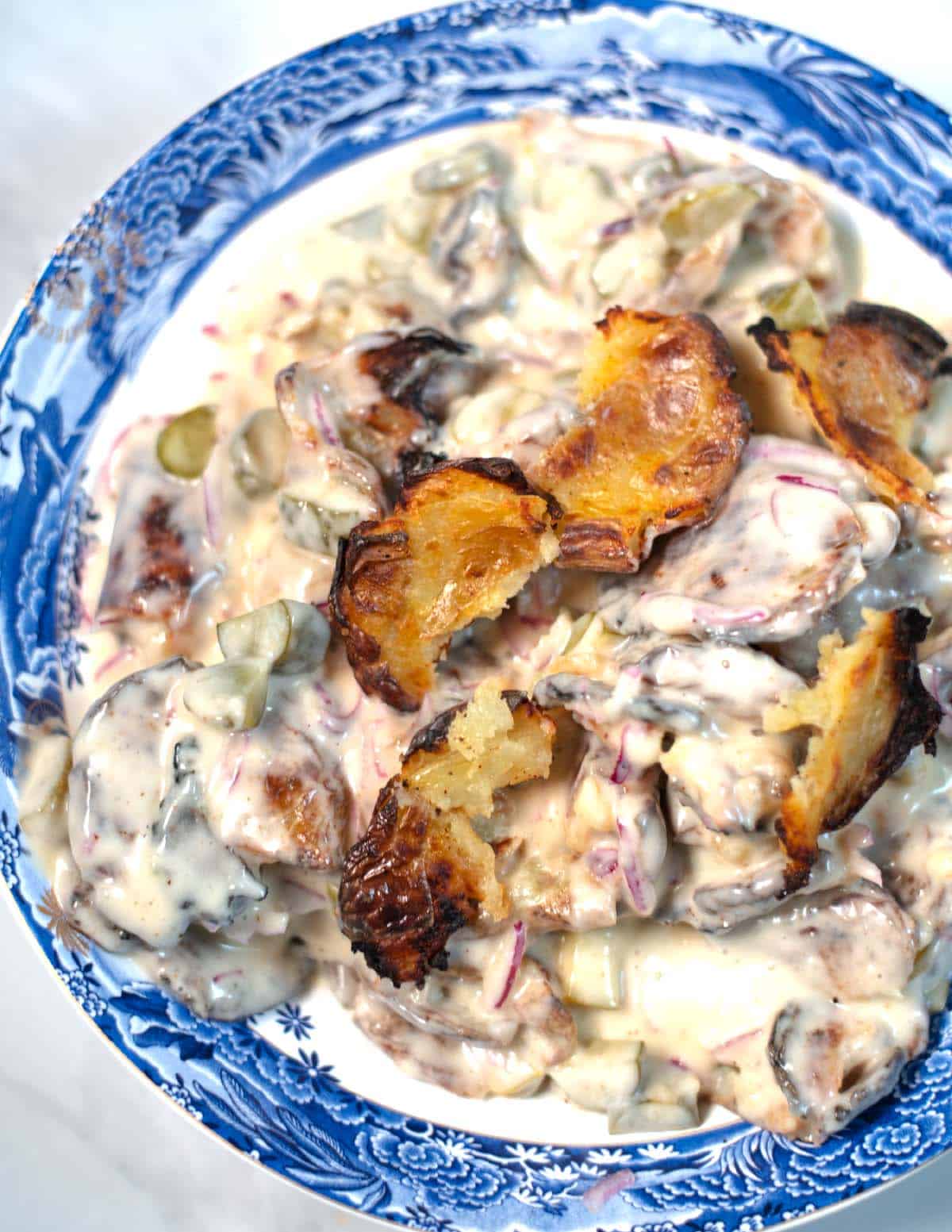 Closeup of smashed poatao salad.