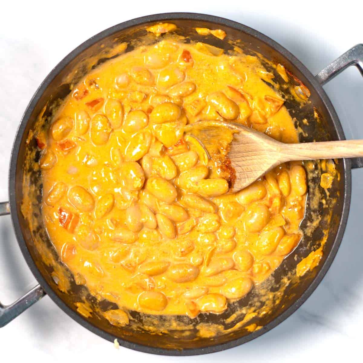Creamy sauce of Harissa Butter Beans.