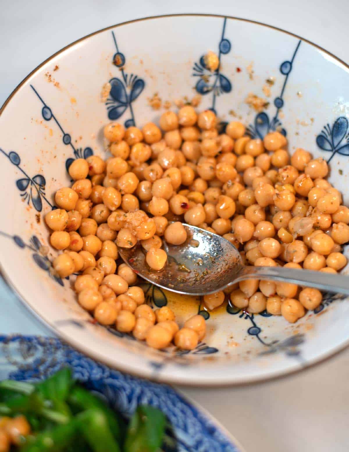 A serving bowl with Marinated Chickpeas.