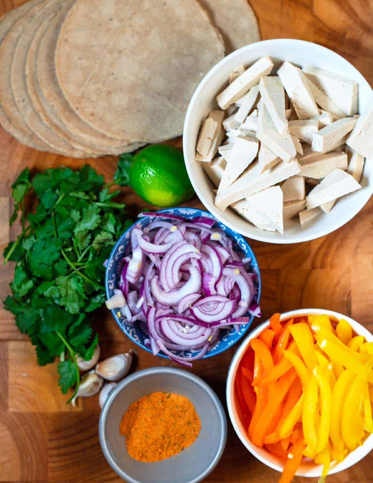 Ingredients needed to make Sheet Pan Fajitas collected before preparation.