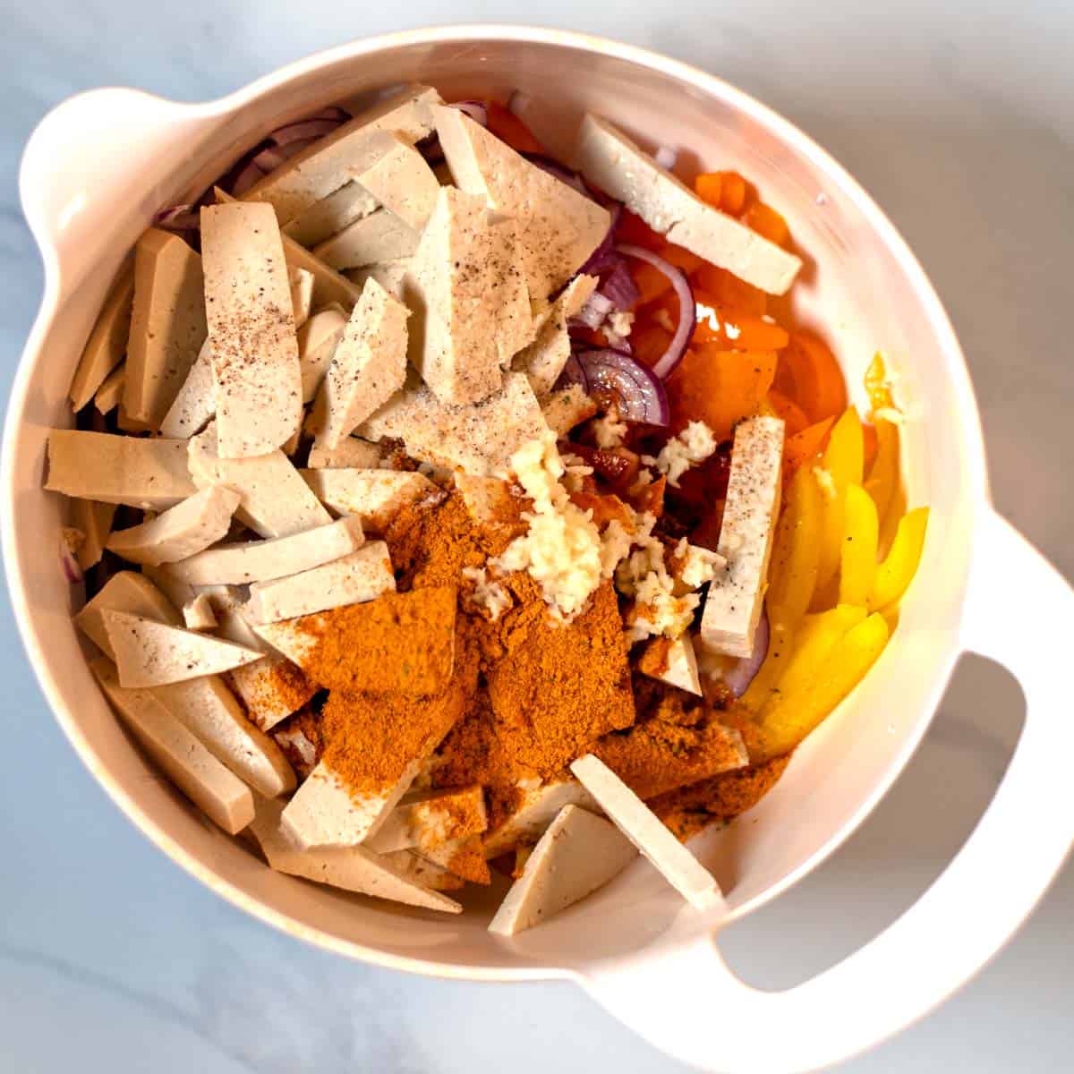 Tofu, onions, bell pepper with spice mixture.