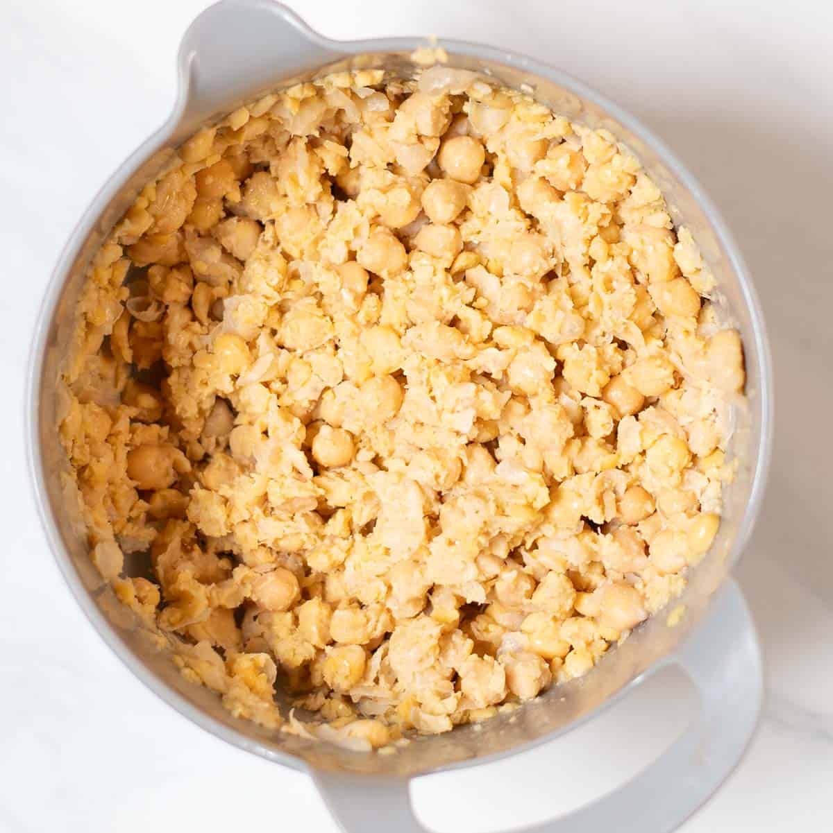 Chickpeas after smashing in a mixing bowl.