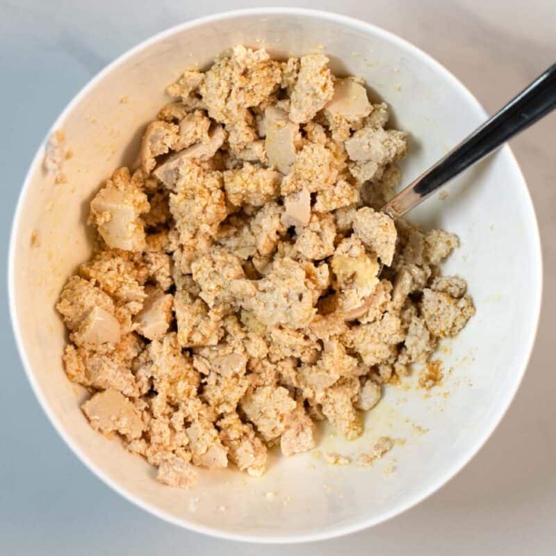 Marinated tofu is set aside.