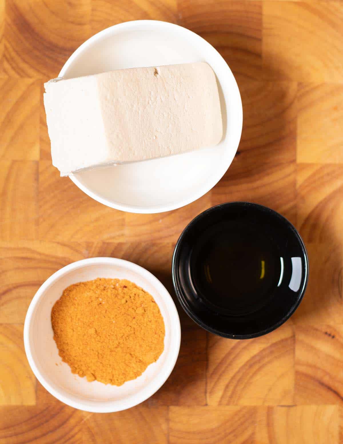 Ingredients needed to make Tofu Shawarma on a cutting board.