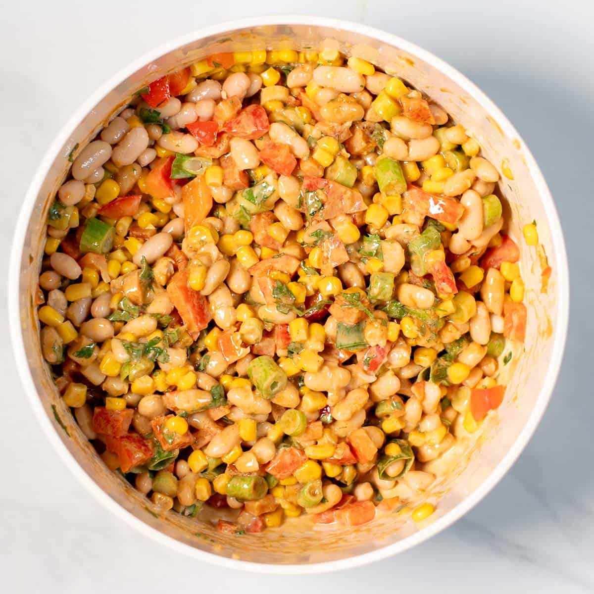 Mixed White Bean Salad in a mixing bowl.