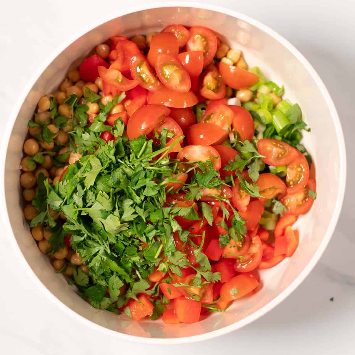 Salad ingredients in a mixing bowl.