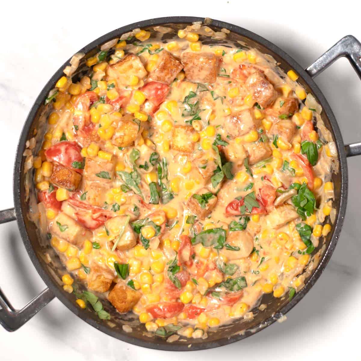Basil tofu in a pan.
