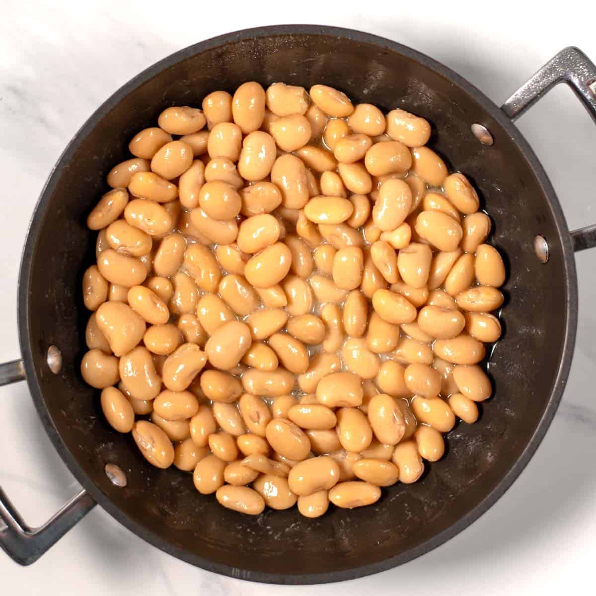 Butter beans in a pan.